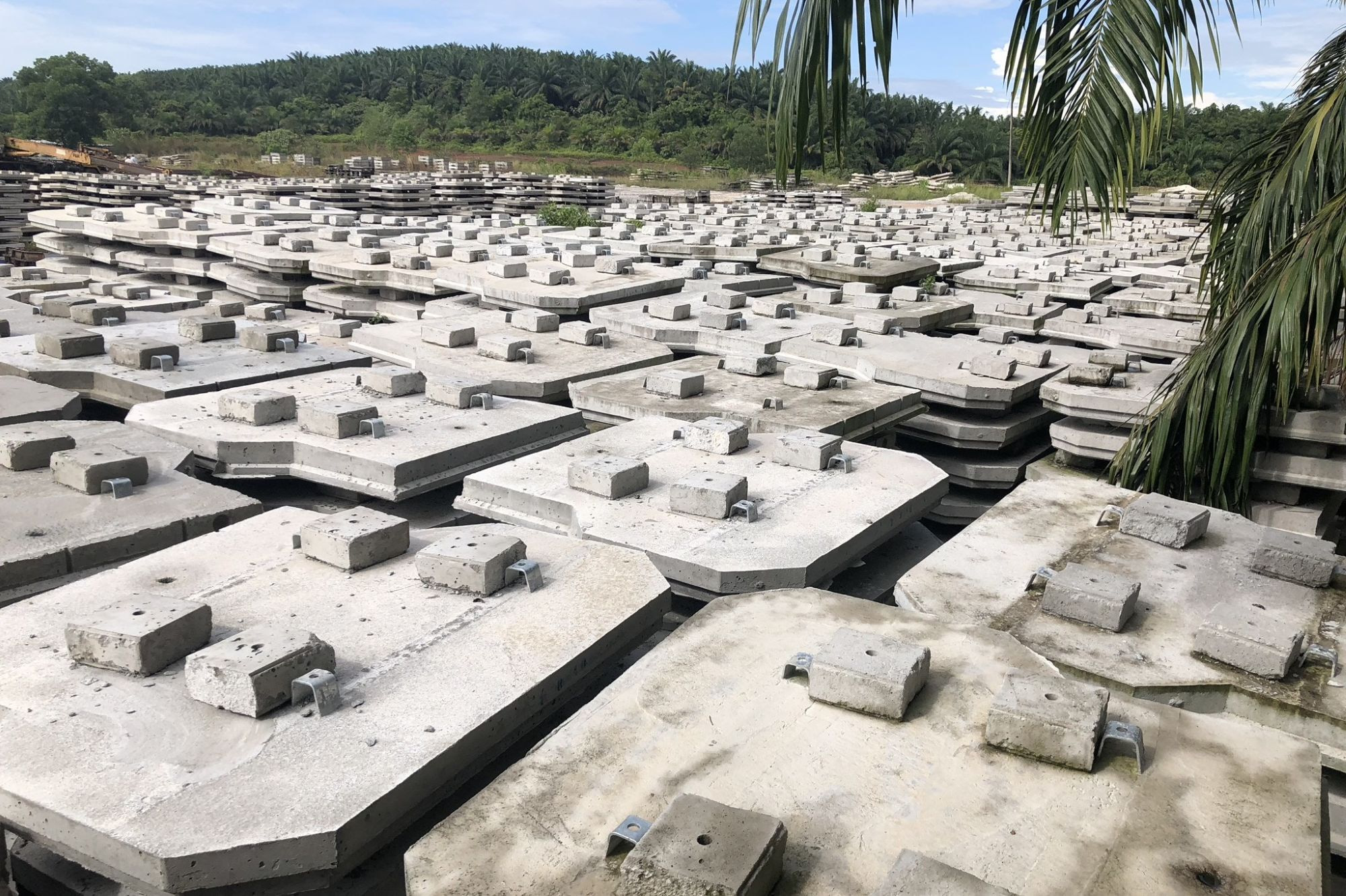 Octagonal precast facing panels stacked in factory yard