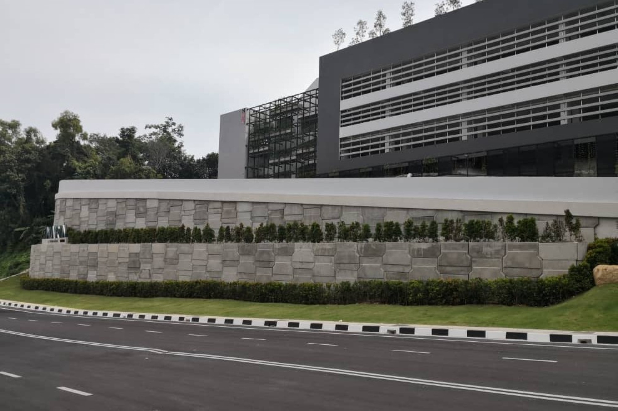 AnchorSOL wall with architectural finish and custom logo cast into precast panel